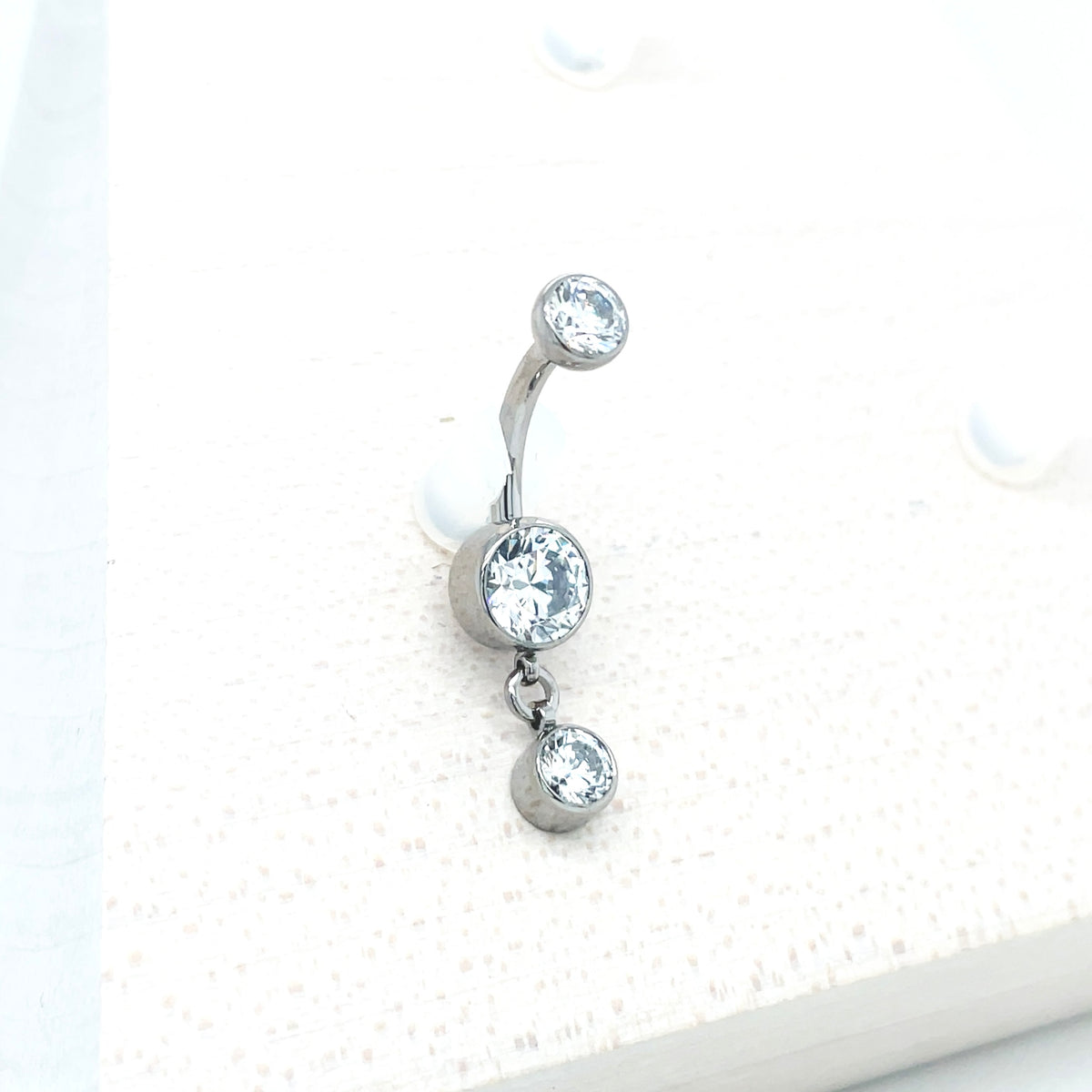 Industrial Strength Titanium White CZ Bezel Dangle Curved Barbell