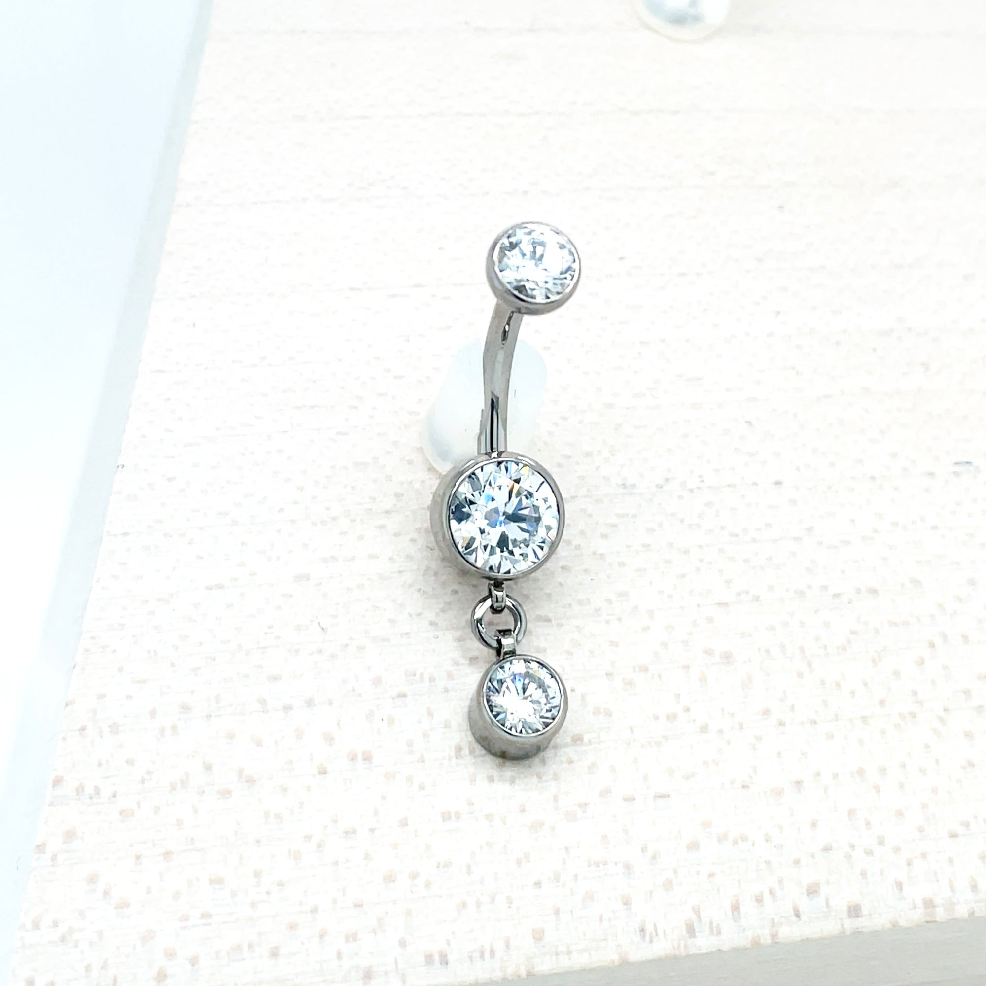 Industrial Strength Titanium White CZ Bezel Dangle Curved Barbell