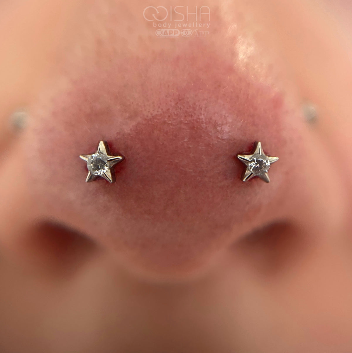 Anatometal titanium Swarovski gem stars in fresh Mantis piercings or forward nostrils performed by Emma at isha body jewellery. 