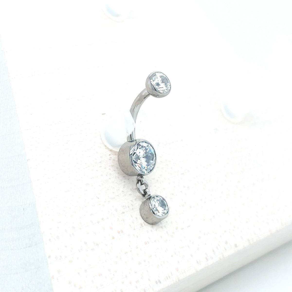 Industrial Strength Titanium White CZ Bezel Dangle Curved Barbell