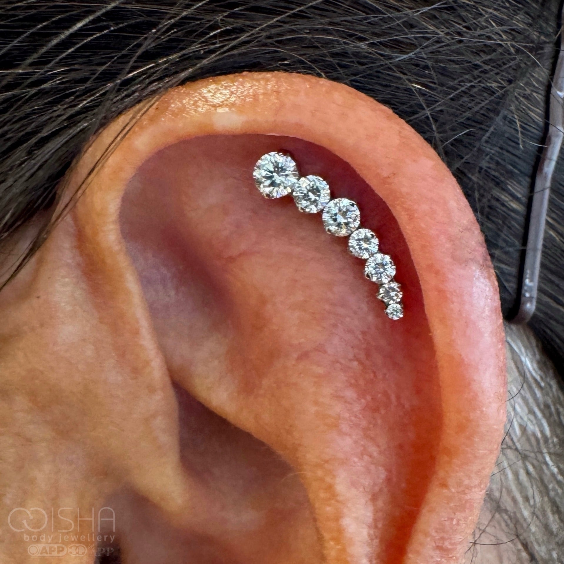 Silver looking cluster earring with clear genuine diamond gemstones on a white background