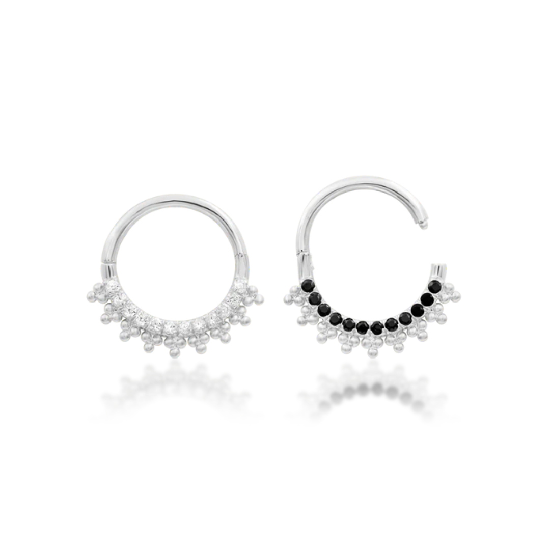 Two pairs of hoop earrings with different bead designs on a white background