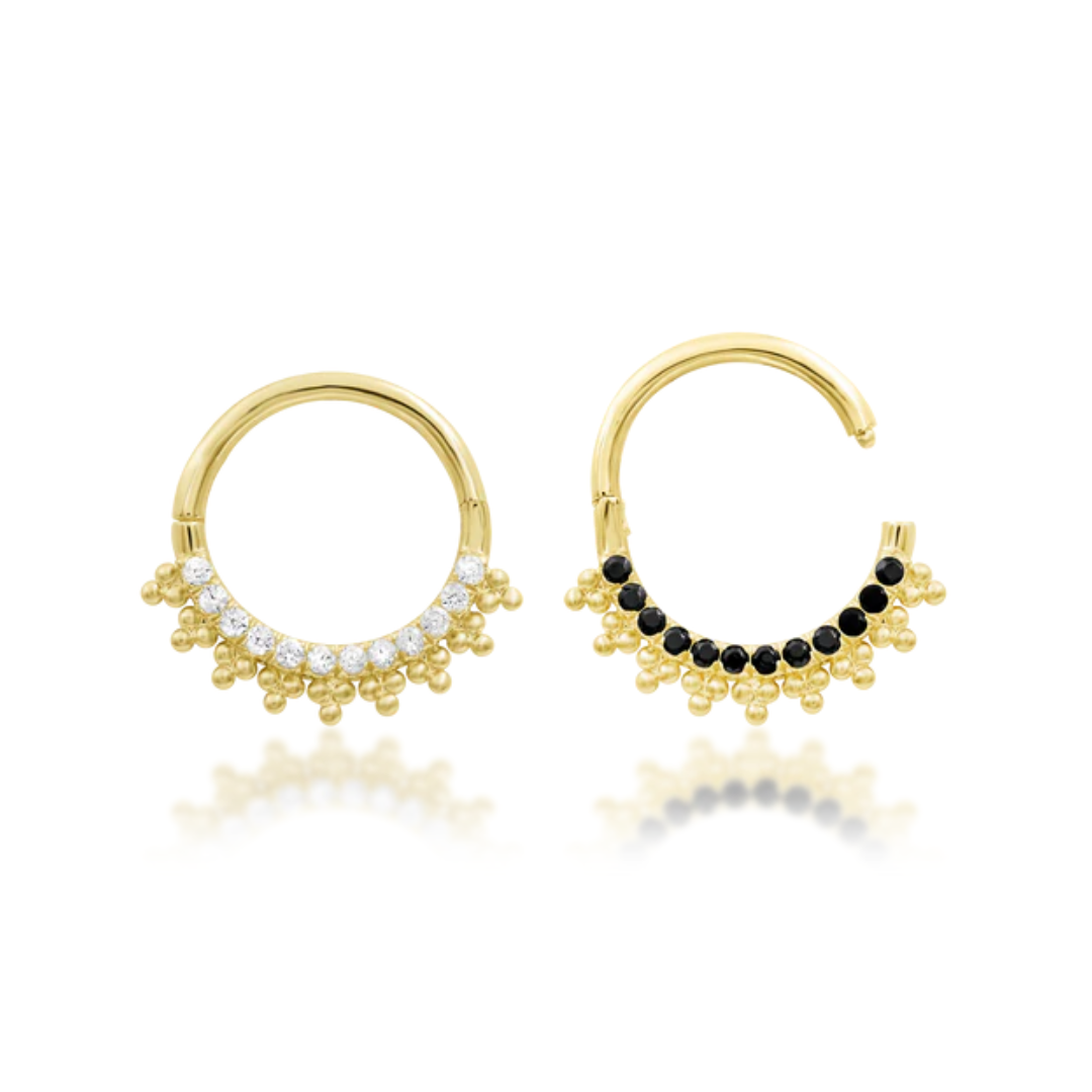 Gold hoop earrings with gemstone accents on a white background