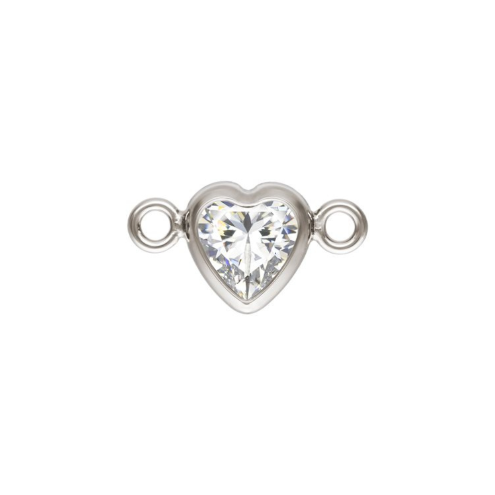Heart-shaped crystal connector with silver metal loops on a white background